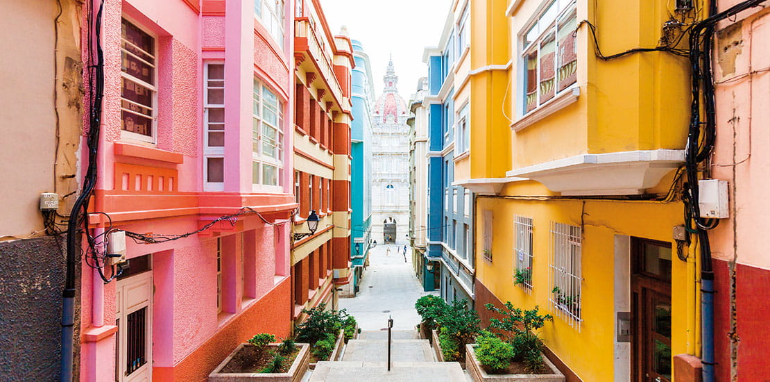 A view down a colourful street in La Coruna, Spain